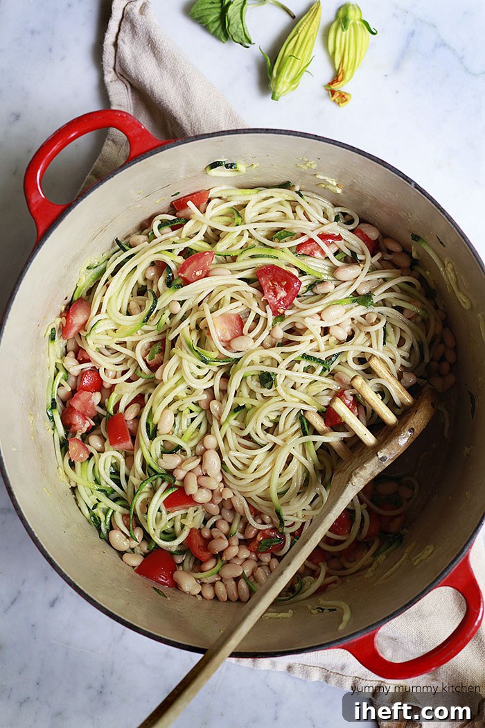 vegan zoodle spaghetti with tomatoes and white beans