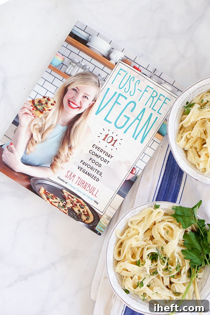 The vibrant cover of the Fuss-Free Vegan cookbook, promising comforting vegan dishes.
