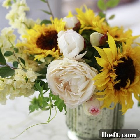 A beautiful DIY flower arrangement with sunflowers and garden roses.
