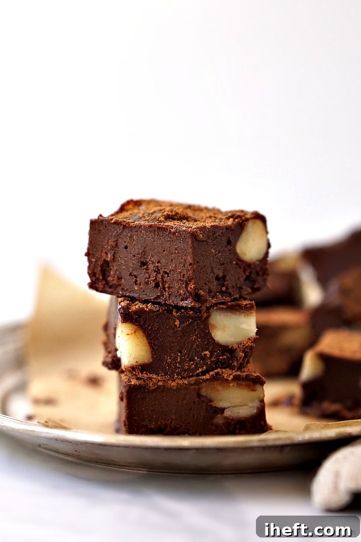 This freezer fudge recipe features wholesome, natural ingredients like creamy cashew butter, rich cacao, and pure maple syrup for a guilt-free dessert.