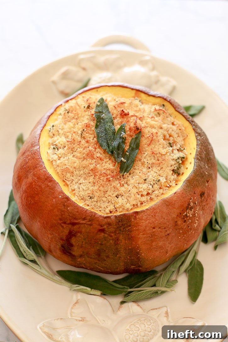 Creamy Pumpkin Mac and Cheese baked inside a whole roasted pumpkin, showcasing a vibrant orange interior and a golden-brown crispy topping. A fun vegetarian take on dinner in a pumpkin for autumn.