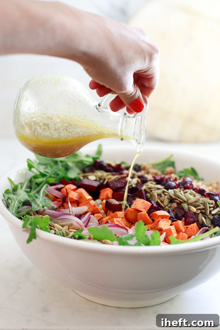 This harvest farro salad is perfectly dressed with a simple yet flavorful homemade apple cider vinaigrette, enhancing its seasonal ingredients.