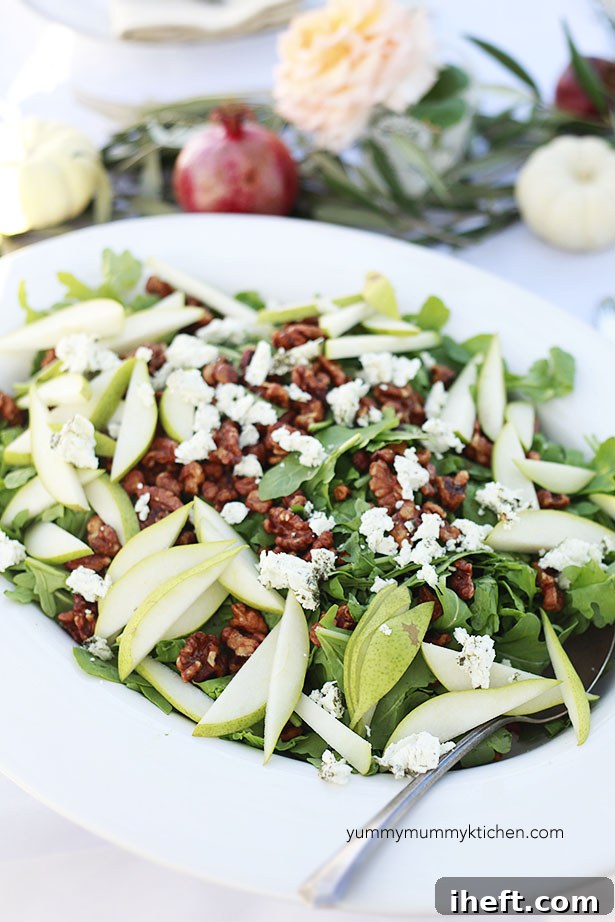 A beautiful autumn salad of arugula, pears, and candied walnuts is perfect for parties. 