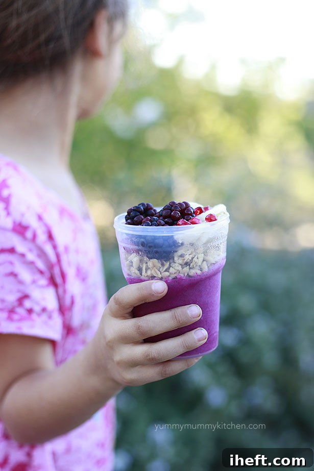 Vibrant pitaya bowl with fresh fruit toppings, a healthy and colorful breakfast or snack option.