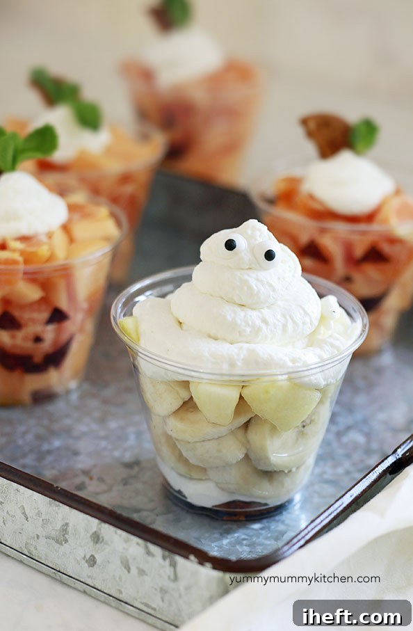 Detailed view of a homemade Spooky Ghost Fruit Cup with candy eyes