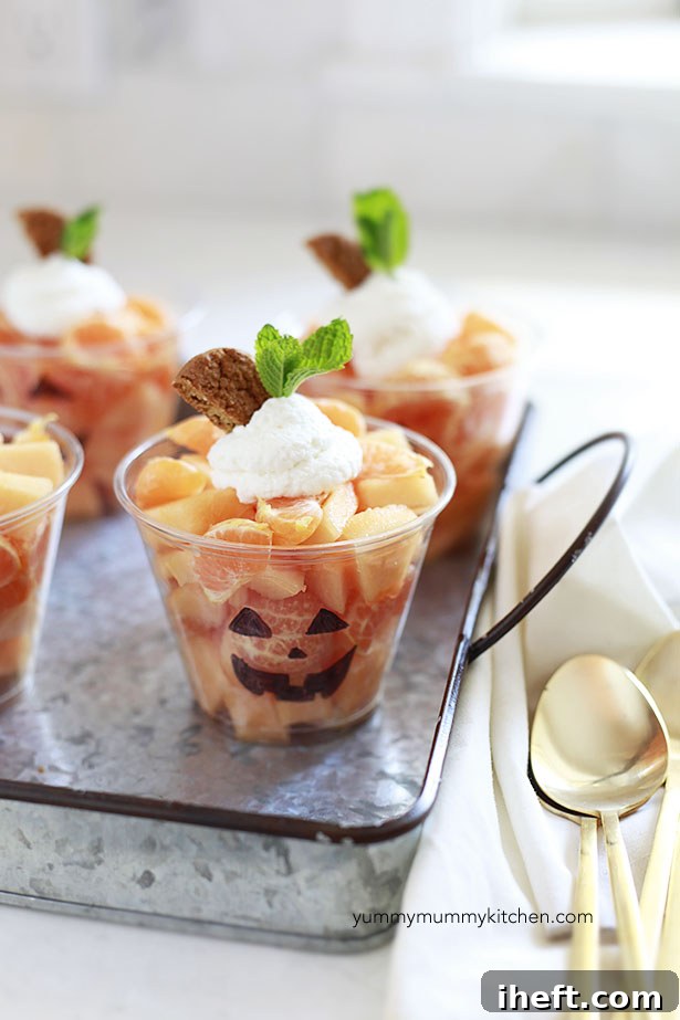 Collection of healthy Halloween fruit cup variations ready for serving