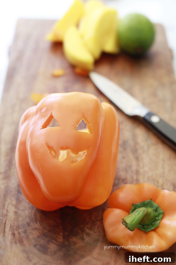 Step-by-step guide to carving bell pepper jack-o'-lanterns for Halloween snacks