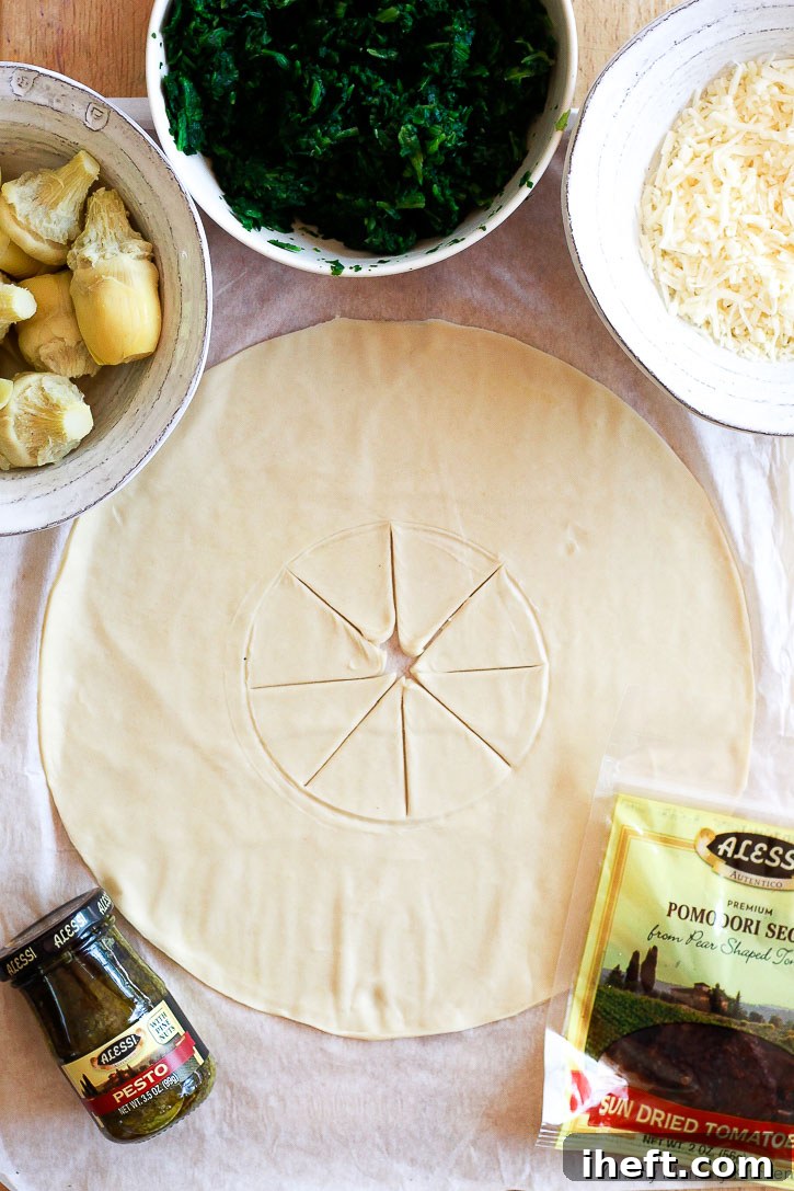Close-up of the golden-brown puff pastry wreath showing flaky layers