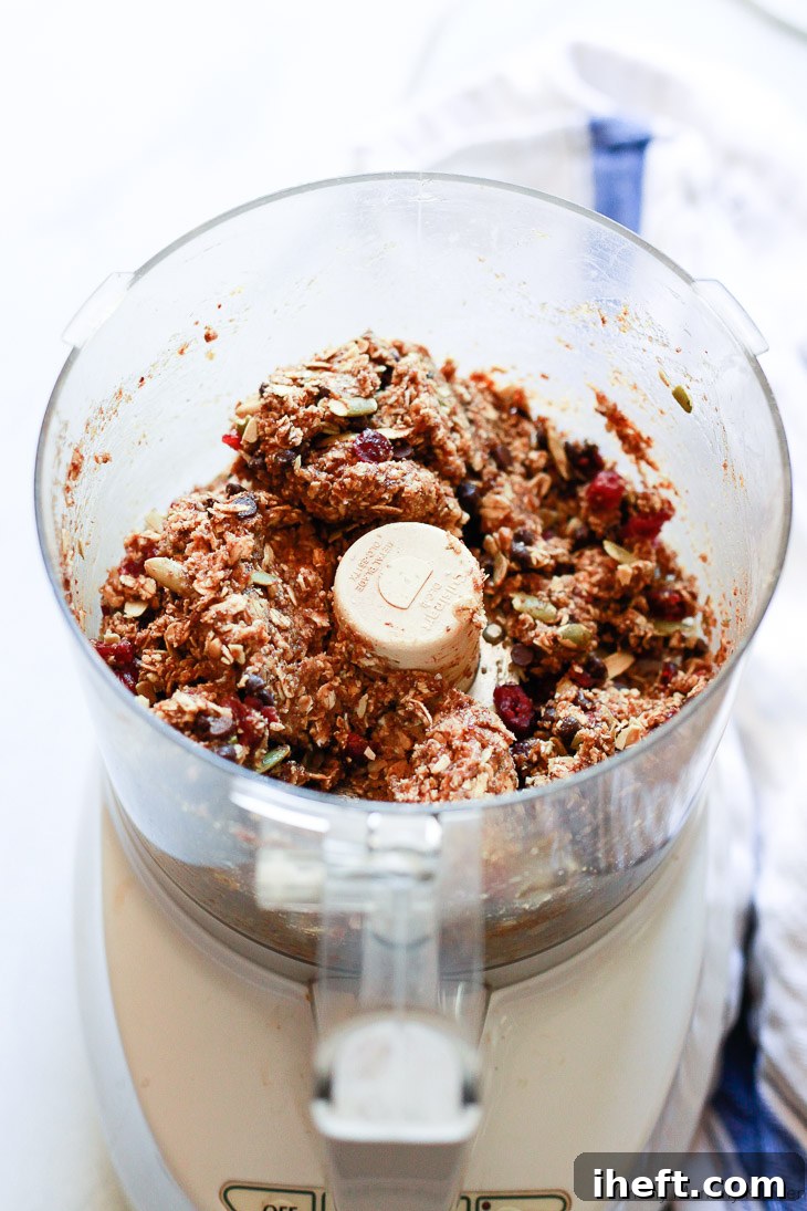 No-bake vegan energy bars are incredibly easy to prepare using a food processor, simplifying the mixing process and ensuring perfect consistency.