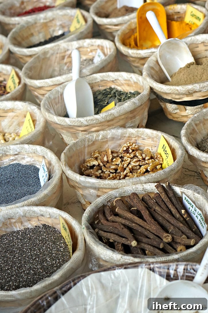 Baskets of seeds, nuts, and spices at a farmers market in Tuscany Italy. 