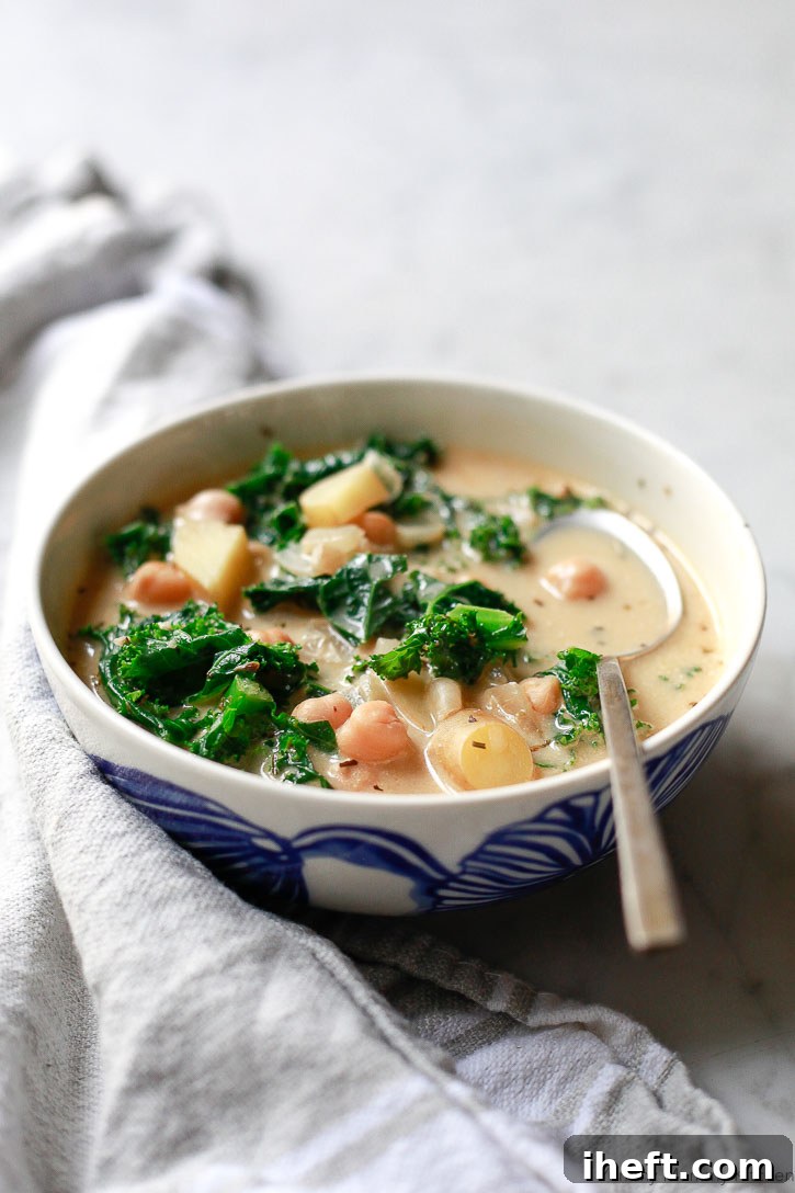 This Olive Garden inspired Zuppa Toscana soup recipe got a healthy vegan makeover. Loaded with kale, potatoes, and chickpeas, this hearty soup is an easy one-pot meal.