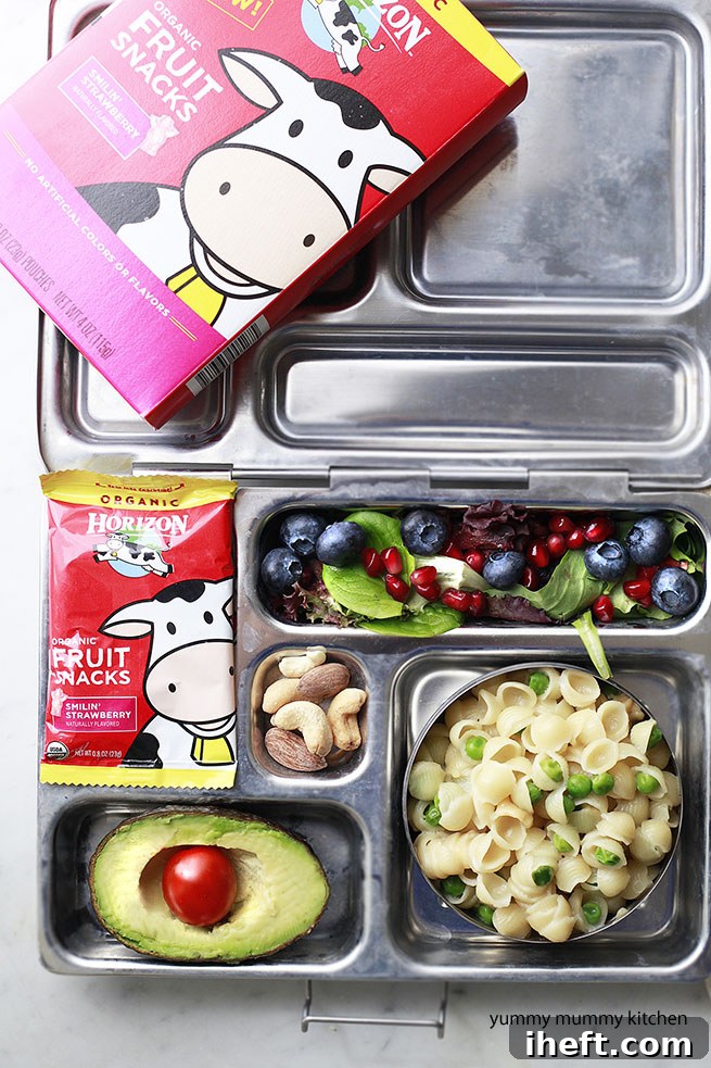 Two Planetbox lunch containers filled with healthy and fun food for kids, featuring Horizon Organic snacks.