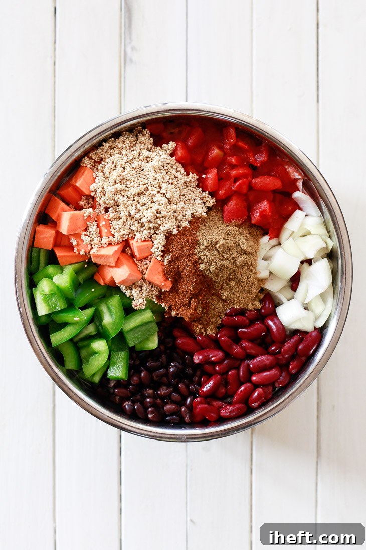 Rich vegetarian chili bubbling in an Instant Pot, featuring colorful bell pepper, tender sweet potato, and wholesome quinoa. 