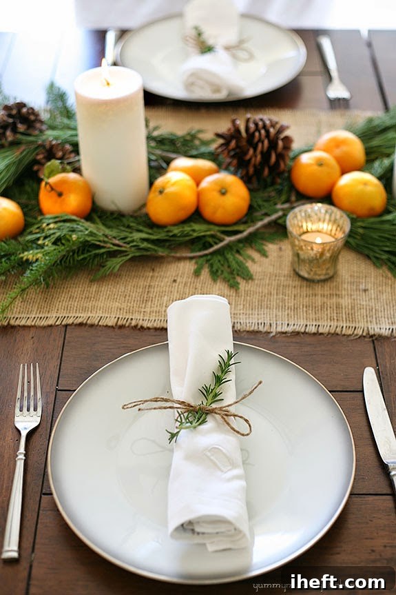 Rustic Christmas table with burlap, pinecones, and mandarin oranges