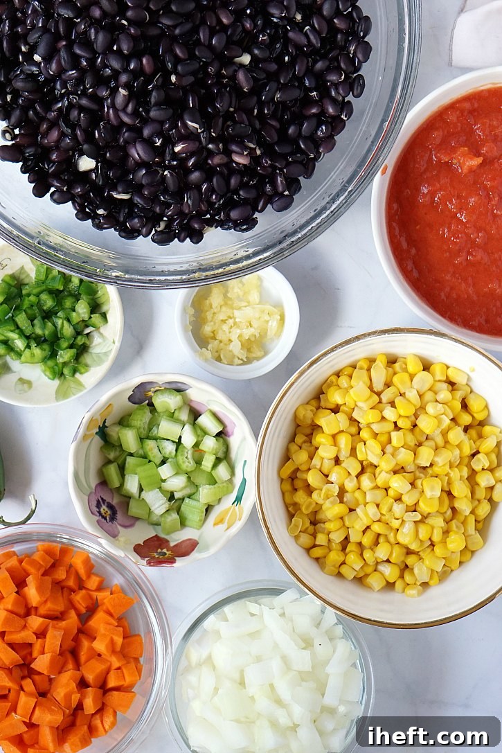 This slow cooker black bean soup features dried beans, an abundance of fresh vegetables, and a savory blend of spices, promising a delicious and hearty meal for cold evenings.