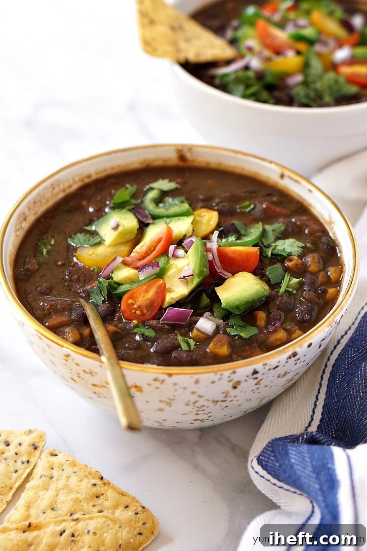 This delightful vegetarian and vegan black bean soup, prepared easily in a slow cooker or crockpot, promises a delicious and hearty dinner for any occasion.