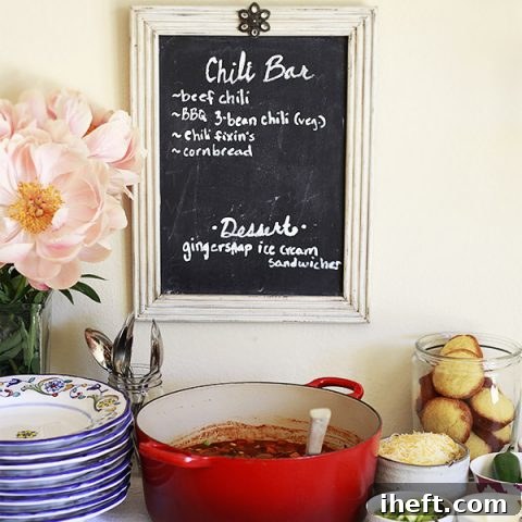 A vibrant DIY vegetarian chili bar spread with various toppings