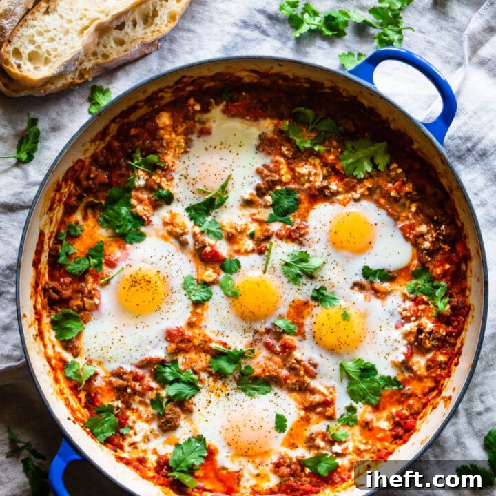 A Dutch oven filled with Italian baked eggs, or Eggs in Purgatory.