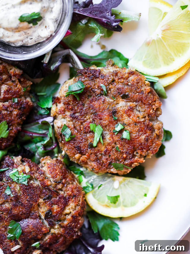 Lion’s Mane Mushroom Vegan 'Crab Cakes' with lemon wedge and herbs