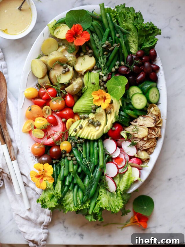 Colorful Vegan Spring Nicoise Salad with fresh vegetables and chickpeas