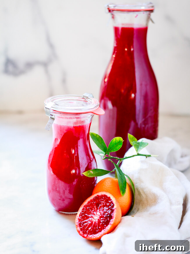 Blood Orange Juice in a glass with orange slices