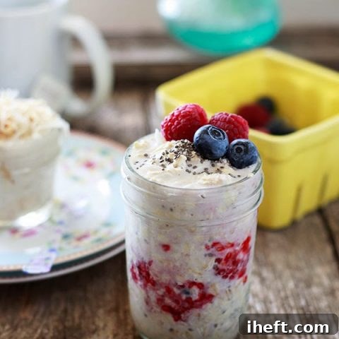 A jar of overnight oatmeal with fresh berries.