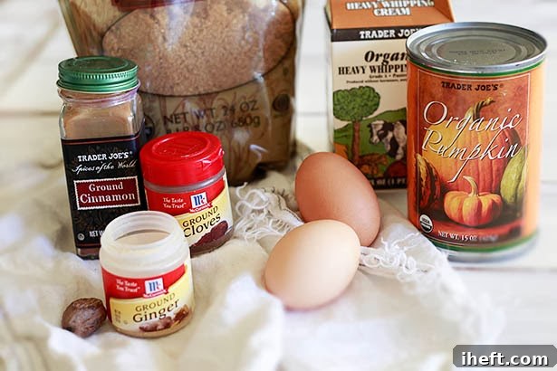 The wholesome ingredients for this homemade mini pumpkin pie recipe include fresh eggs, organic canned pumpkin puree, rich heavy cream, brown sugar, and aromatic spices.