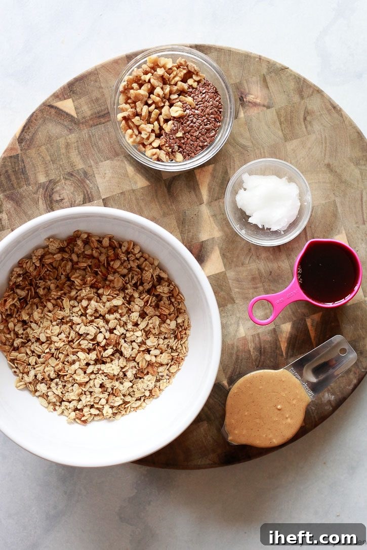 Ingredients for crunchy homemade no-bake granola bars include pre-made granola, peanut butter, maple syrup, flax, and coconut oil. 