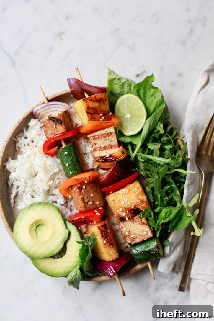 Delicious homemade teriyaki sauce expertly used to glaze colorful grilled vegetable and pineapple skewers, showcasing its incredible versatility for summer BBQs, party appetizers, or a healthy side dish.