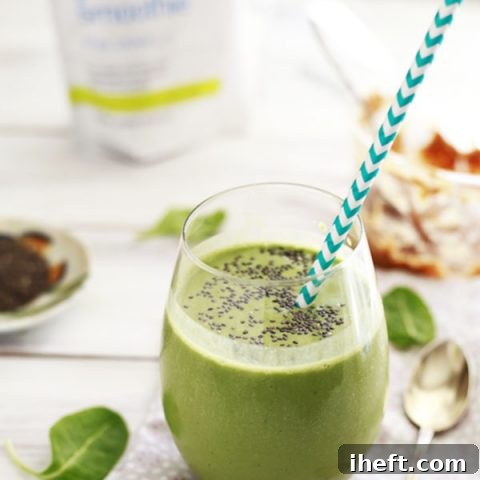 Vibrant green smoothie with peanut butter, topped with chia seeds, in a clear glass, inviting you to take a healthy sip.