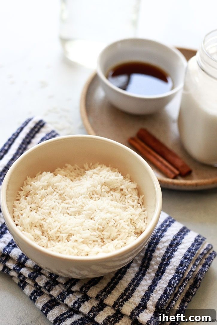 The ingredients for homemade horchata include white rice, maple syrup, cinnamon sticks, and almond milk. 