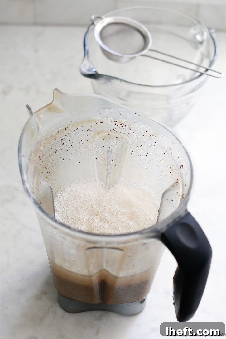 A Vitamix blender filled with homemade horchata. 