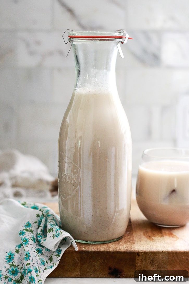 A Weck carafe filled with homemade horchata in a white kitchen. 