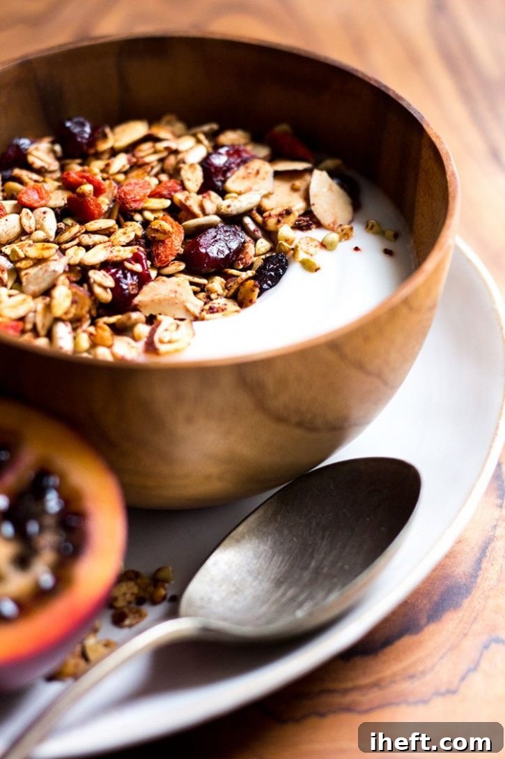 A colorful bowl of Eat Your Reds Granola with beetroot and berries, a unique and healthy breakfast.