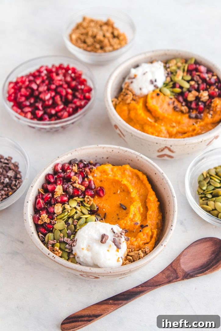 A vibrant bowl of fluffy sweet potato breakfast bowls topped with fresh fruit and nuts, radiating cheerful colors.