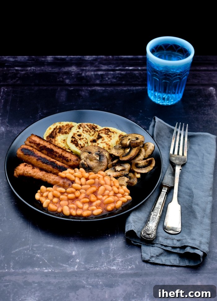 A classic Scottish full vegan breakfast featuring potato scones and other savory components.