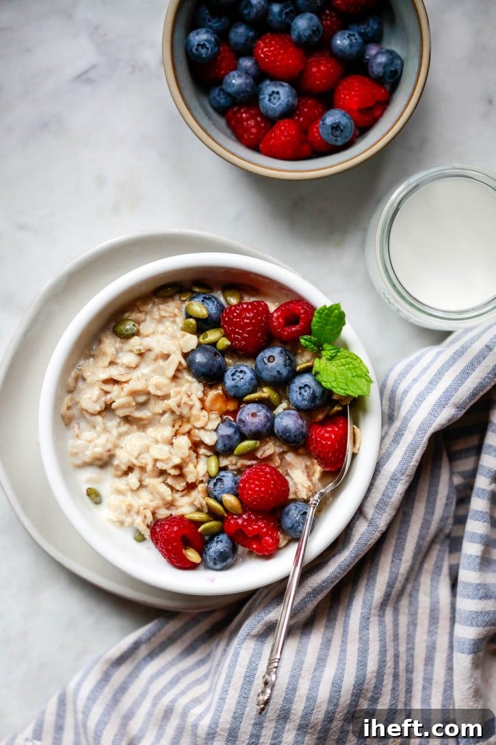 A cozy bowl of high-protein oatmeal topped with fresh berries, ideal for a cold morning after a workout.