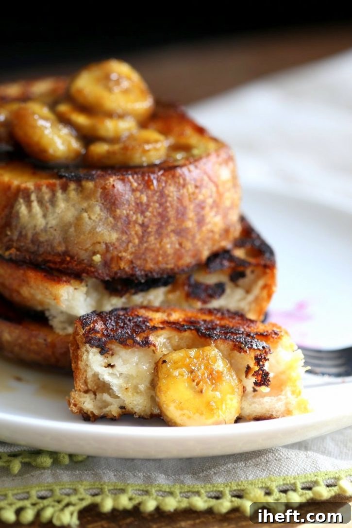 Decadent vegan banana French toast with caramelized bananas, drizzled with syrup.