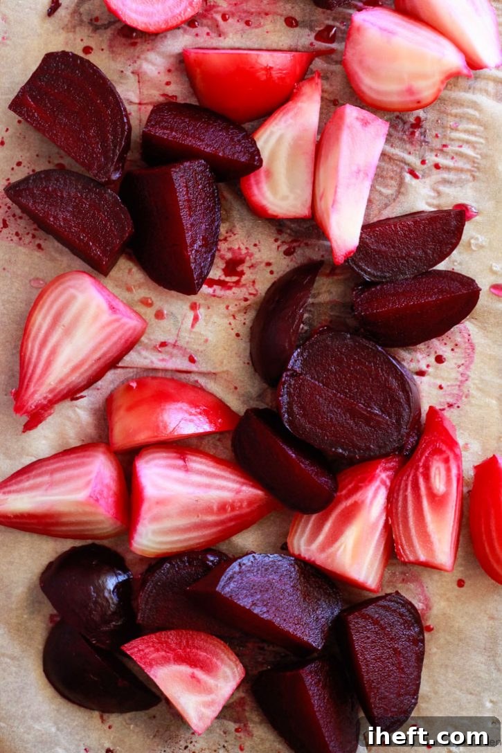 A stunning display of cut roasted candy cane and deep purple beets, showcasing their vibrant colors and perfect texture.