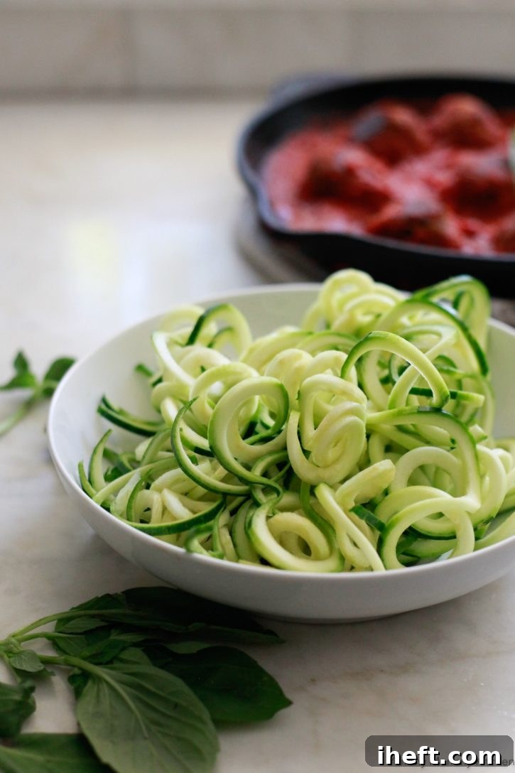 A bowl of freshly spiralized zucchini noodles is perfect for serving with vegetarian lentil meatballs. 