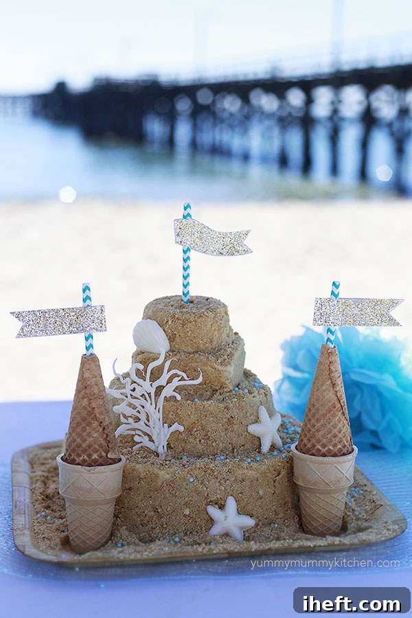 A close-up view showcasing the intricate details and decorations of the sandcastle birthday cake.