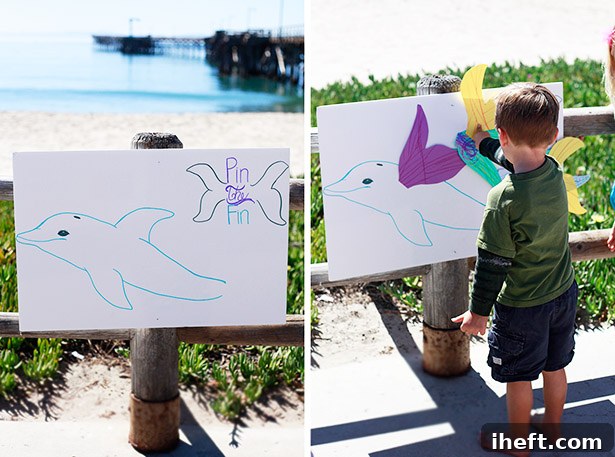 Kids playing Pin the Fin on the Dolphin at a beach party