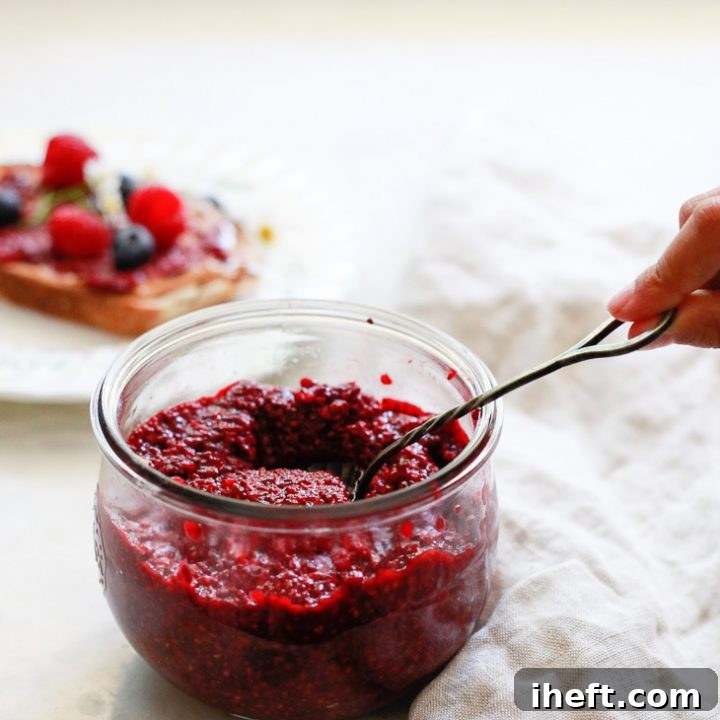 Delicious homemade chia jam made from mixed berries, served in a glass jar, ready to be enjoyed. A perfect example of a healthy and easy-to-make berry spread.
