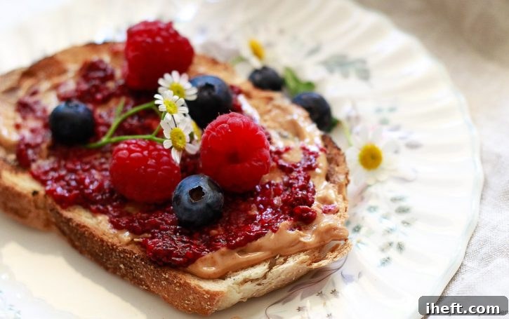 Three slices of toast topped with various spreads: one with peanut butter and berry chia jam, one with just berry chia jam, and one with a rich nut butter. This image beautifully illustrates diverse ways to enjoy homemade chia jam on toast.