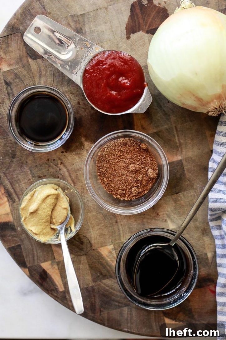 A spread of essential ingredients for vegetarian baked beans, featuring rich ketchup, fragrant onion, sweet molasses, balanced coconut sugar, zesty Dijon mustard, and a special vegetarian Worcestershire sauce.