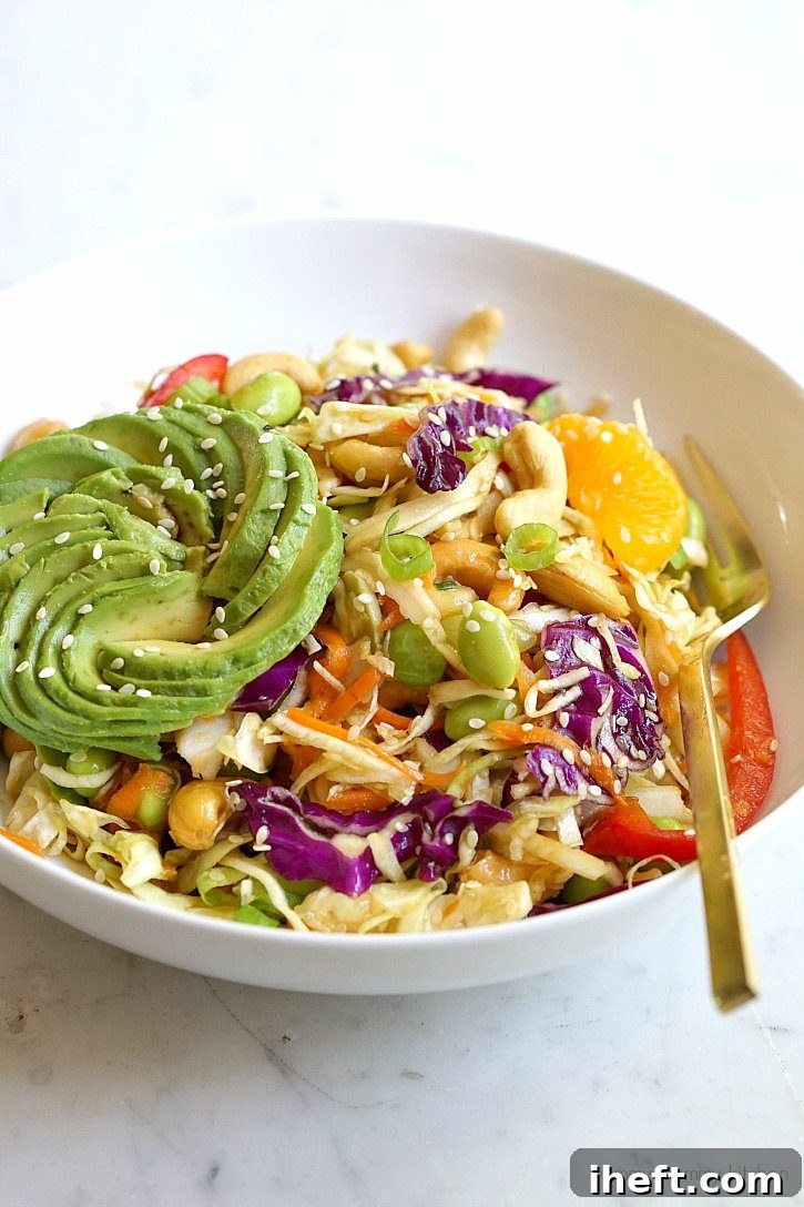A vibrant Asian cabbage salad, featuring crisp edamame and a savory ginger sesame dressing, demonstrating a creative and healthy way to utilize coleslaw mix.