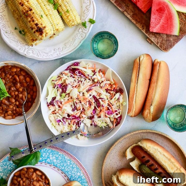 A beautiful vegan BBQ spread featuring homemade creamy vegan coleslaw as a centerpiece.