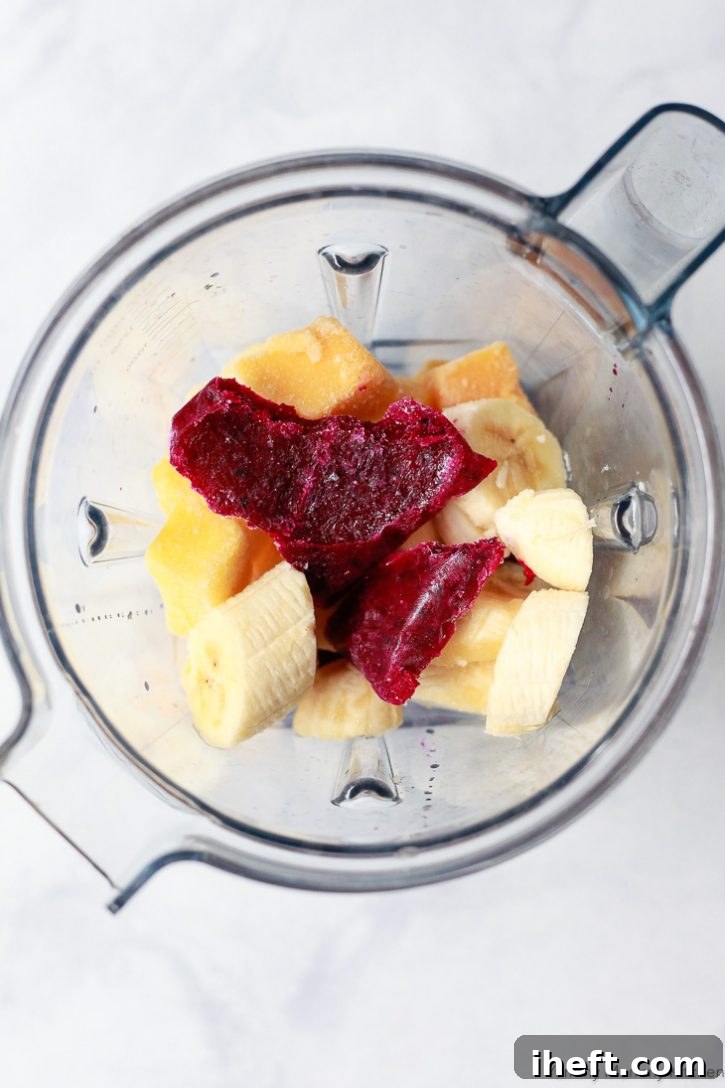 The ingredients for a dragon fruit smoothie in a Vitamix blender. 
