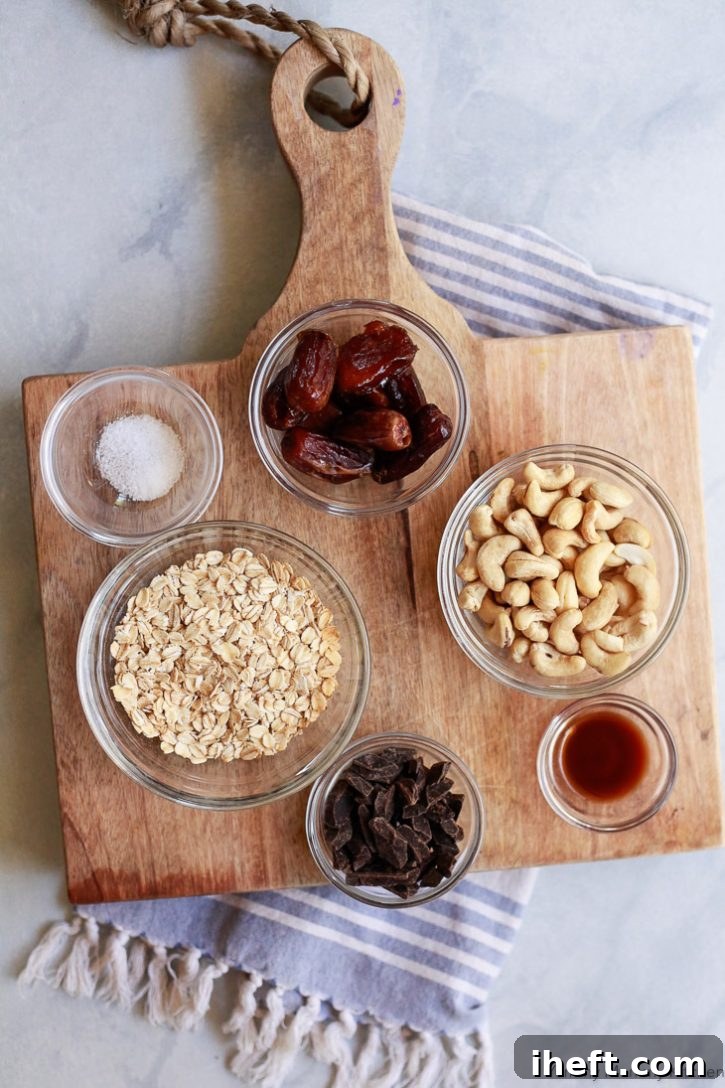 A vibrant display of ingredients for healthy no-bake oatmeal cookies, including wholesome oats, succulent dates, raw cashews, pure maple syrup, and rich dark chocolate, all essential for this delightful recipe.