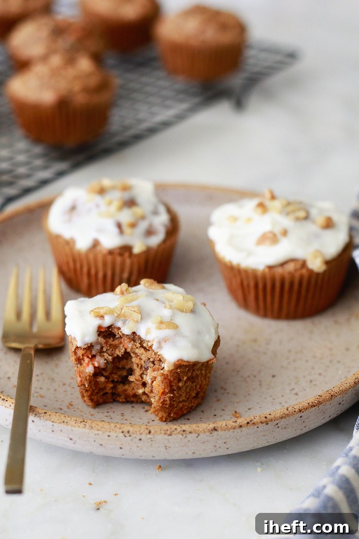 Healthy carrot muffins made with oat flour and topped with a creamy vegan cream cheese frosting. These delicious blender carrot muffins are perfect for a gluten-free and vegan diet.